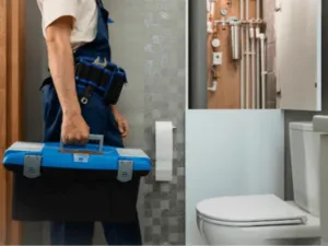 un idraulico con valigetta degli attrezzi in un bagno